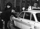 View: u10487 Policeman and policewoman with police car on St. James' Row showing the Midland Bank (opposite)