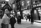 View: u10752 Fargate showing Dixons (right) and the entrance to the Orchard Square Shopping Centre (left)