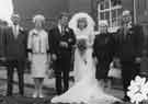 View: u10876 George Clayton (1st right) and his sister-in-law, Elsie Bacon (2nd right) at the wedding of Elsie's daughter, Pauline at Sutton Social Institute