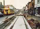 View: u10977 Construction of Supertram tracks on Langsett Road showing (l.to r.) No.546 Fella's Barber Shop, No.544 Manalive, tailors and gents outfitters and No.542 Langsett Kitchens