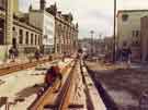 View: u11003 Construction of Supertram stop on Commercial Street showing (top right) Barclays Bank and (top centre) Gas Company offices