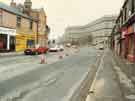 View: u11007 Construction of Supertram on Langsett Road showing (left) Langsett fish and chip shop, Mick Flynn motorcycles, Nos.56-58 the Wellington public house and (top centre) Kelvin flats