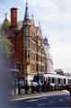 View: v04640 Supertram on High Street, the red brick building was originally built for Pawson and Brailsford, stationers