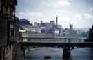 View: w02661 Iron Bridge (footbridge) over the River Don from Borough Bridge looking towards Manchester Hotel; John Aizelwood Ltd., Crown Corn Mill and Holy Trinity Church, Nursery Street