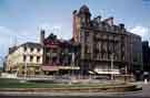 View: w02752 Town Hall Square and the Goodwin Fountain showing shops on Fargate (l. to r.)  (No.70) H.L. Brown and Son Ltd., jewellers, (No. 68), Cantors Ltd., furniture dealers and (left) Pinstone Street