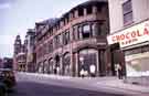 View: w02771 Norfolk Street at junction with Change Alley showing (left) (Nos. 36-38), Thomas A. Ashton Ltd., engineers, and (right) No. 18 Thorntons Chocolate Kabin