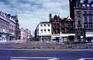 View: w02806 Surrey Street looking towards (centre) No.70 H.L. Brown and Son Ltd., jewellers: No.68 Cantors Ltd., house furnishers, Fargate and the Goodwin Fountain and (left) Leopold Street