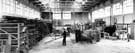 W. Fearnehough Ltd., Garden Street Works - part of warehouse, showing steel stocks, flattening and cutting machinery, 1960s