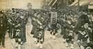 View: y05763 Harry Lauder's Pipe Band on a recruiting mission in Sheffield passing down Pinstone Street followed by R. A. M. C. from Sheffield Barracks. 