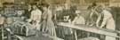 View: y05880 Some members of the Army and Navy Aid Committee at work at the Cutlers' Hall, cutting out and packing garments for soldiers and sailors