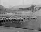 View: y11176 Visit of Queen Elizabeth and HRH the Duke of Edinburgh to Hillsborough football ground to see the children's display during their visit of 27th October 1954.