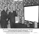 View: y11350 Mr Van der Plirym presents Mr Arthur Mills, export sales manager, with cine equipment bought by the Agents at the Royal Victoria Hotel Arundel Suite on 23 November 1959