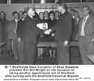 View: y11352 Mr L. Bowthorpe, Head Convenor of shop stewards, presents Reverend Bill Wright, on the occasion of taking another appointment out of Sheffield after serving with Sheffield Industrial Mission.