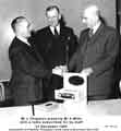 View: y11364 Mr L. Chapman presents Mr A. Mills with a radio subscribed for by staff at Jessop Saville Ltd, 31st December 1959.