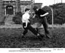 View: y11647 Playing football outside William Jessop and Son Ltd's Whiston Grange Research Centre, c. 1950