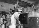 View: y11762 School meals; cooked potatoes being taken out of one of the up-to-date cookers in a cooking centre