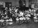 View: y11766 School meals; infant children dining in a school hall 