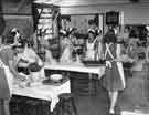 View: y11767 School meals; waitresses cleaning away after dinner 