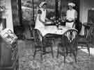 View: y11772 School meals; tables being prepared for dinner at a combined domestic subjects centre