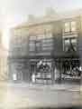 View: y12304 Shops on London Road, Heeley showing (l. to r.) (No.83) J. W. Bell and Co., watchmakers; (No.85) Isaac Buck and Son, grocers and off licence and (No.87) J. W. Rodgers, butchers 