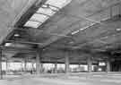 View: y13451 Interior of Sheffield Transport Department, Herries Road Bus Garage showing third bay being constructed