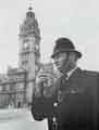 View: y13627 Sheffield and Rotherham Constabulary: '10 o'clock and all's well' reports Constable John Mason outside the Town Hall