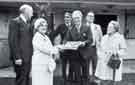 View: y13673 South Yorkshire Police: Mrs Annie Robinson receiving from the Chairman of the Police Authority, Councillor E. Fox, JP, an award for successfully naming the newest recruit to the Mounted Section - 'South Yorkshire Lass'