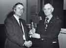 View: y13699 South Yorkshire Police: Deputy Chief Constable, Mr C. F. Gutsell, QPM, (left) presenting Bill Pettigrew an award for outstanding service to the Sports and Social Club