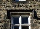 View: a05514 Ornamental dripstone over the window of 38 Collegiate Crescent, with carved heads