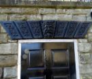 View: a05574 Carved details above doorway of No. 6 Clarke Dell formerly Grove