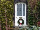 View: a05588 Front Door of No 10 Park Lane decorated for Christmas