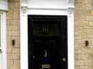 View: a05590 Carved details on the front Door of No 16 Broomgrove Road