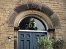 View: a05599 Carved half light over the doorway of 63 Clarkegrove Road 