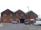 View: a06741 View from Forncett Street of entrance to Carwood Park factory units on Carwood Road showing (right) Express Tyres