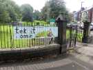 View: a07544 'Tek it home', anti litter banner on railings at entrance to Meersbrook Park, Meersbrook Park Road and (right) Brook Road