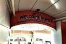 Welcome Home sign by Hendersons Relish at Sheffield Railway Station