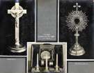 Crucifix (left), pocket communion set in case (centre) and monstrance (right) made by Walker and Hall