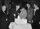 View: arc07131 John Henry Bingham, Lord Mayor of Sheffield, 1954-1955: Cutting the model cake [of Town Hall], Gaumont Theatre, Barkers Pool