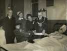 Lord Mayor, Councillor Samuel Hartley Marshall JP and Lady Mayoress, Mrs Marshall with patient on Christmas Day at the Royal Hospital