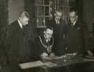 Lord Mayor, Councillor Samuel Hartley Marshall JP (sitting) signing the receipt for the writ for the Attercliffe Parliamentary by-election