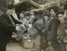 Lady Mayoress, Mrs Marshall (centre) holding a baby at the Bring and Buy Market held by the Sheffield Jewish Ladies' Comforts Committee