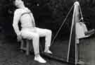 View: h00301 Miner possibly doing neck and back strengthening exercises, Miners Rehabilitation Centre, Royal Infirmary Firbeck Annexe, Firbeck Hall 