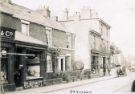 View: p01671 Fulwood Road, Ranmoor, showing No. 392, Burgon and Co., grocers; No. 390, George Memmott, fish and game dealer and No. 378 Ranmoor Post Office 