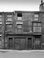 Little Mesters workshops on possibly Ecclesall Road showing (left) J. Wilson, buffer and (right) Geo. Herrett, pewter manufacturer, Globe Cutlery Works