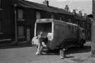 Bin man and bin lorry, c.1970s