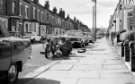 Repairing a motorbike, Greystones, c.1970s