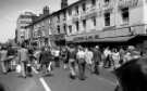 Crowds at the Lord Mayor's Parade, Leopold Street showing (l. to r.) No. 55 Three Tuns public house, No. 57 Shampoo, unisex hairdressers and H. L. Brown and Son Ltd., jewellers, No. 70 Fargate