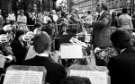 Brass band playing on the steps of the Town Hall, 1970s