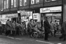 Workers march, Church Street showing (l. to r.) No.39 Toone and Co., estate agents, surveyors and valuers, No.43 Midland Opticians and No. 45 Smith's, drycleaners, 1970s