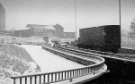 Snow on Park Square roundabout looking towards (centre) Shukers of Sheffield Ltd., motor engineers and commercial motor body builders, Nos.50 - 60 Broad Street and South Street, 1970s